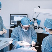 Team of surgeons placing dental implants in Fairfax