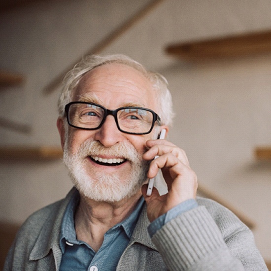 older man talking on the phone