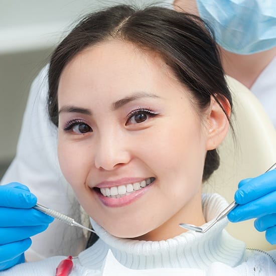 Woman receiving dental checkup