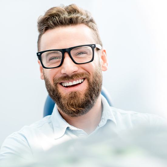 Man laughing in dental treatment room