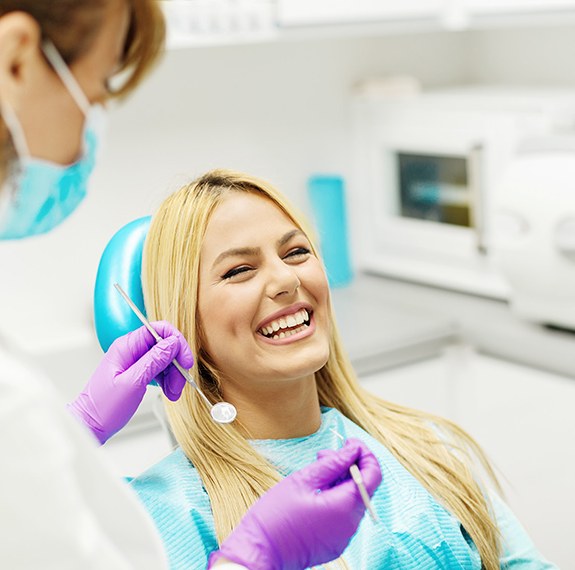 Woman in dental chair smiling