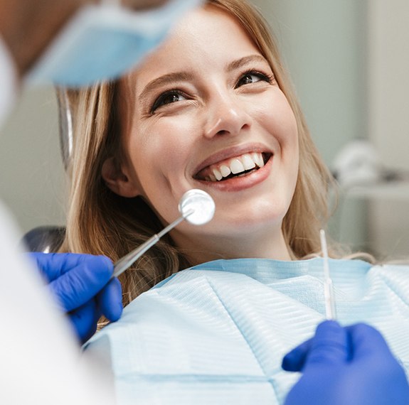 Patient in Fairfax smiling at their dental checkup