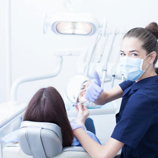 Patient in Fairfax smiling at their dental cleaning