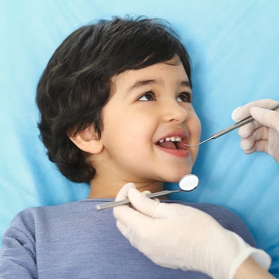 Little boy receiving dental checkup