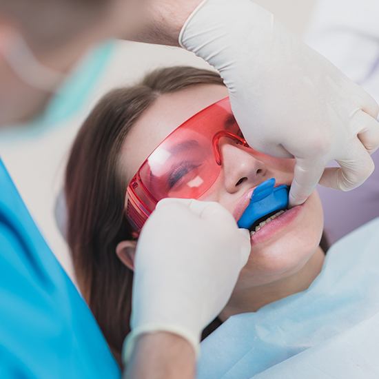 Child receiving fluoride treatment