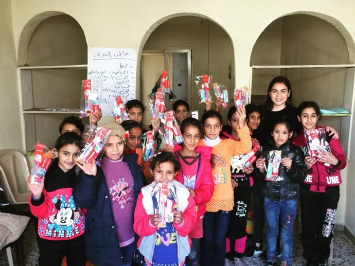 Doctor Ghumrawi with group of children