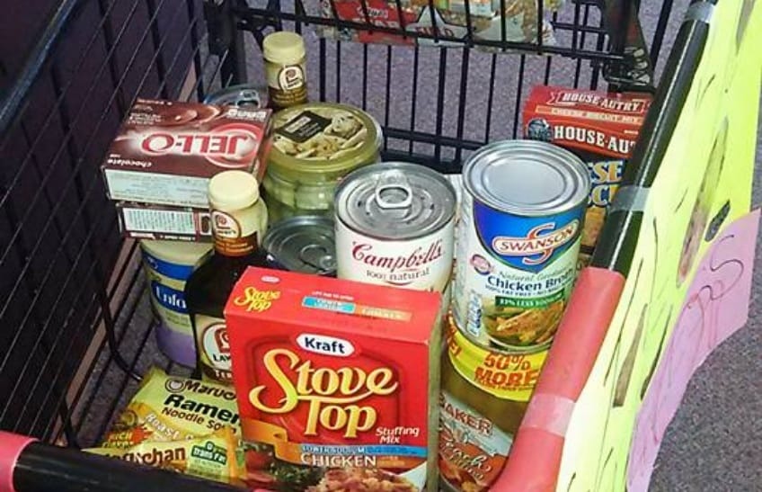 Non perishable foods in a grocery cart at food drive
