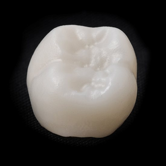 dental crown in Fairfax on black background