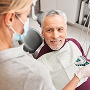 patients smiling while getting dentures in Fairfax