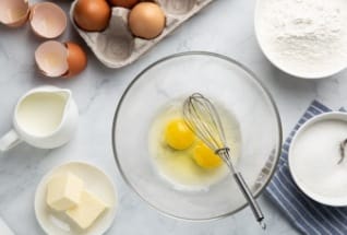 Eggs bowls and cooking utensils in kitchen