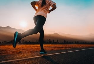 Woman running on a track