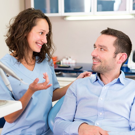 patient talking to dentist in Fairfax