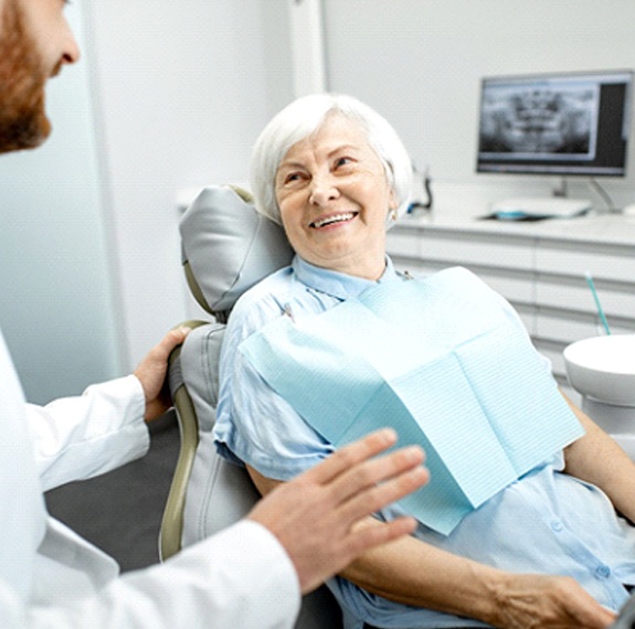 Implant dentist in Fairfax speaking with a patient
