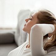 a woman resting per dental implant post-op instructions