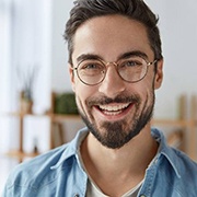 A man with dental implants in Fairfax smiling inside