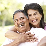An older couple with dental implants in Fairfax smiling
