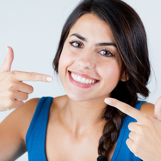 woman smiling with Invisalign results