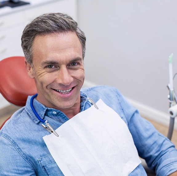 Happy dental patient at appointment with MetLife dentist in Fairfax