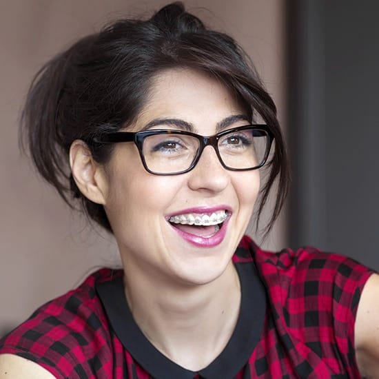 Woman smiling with traditional braces