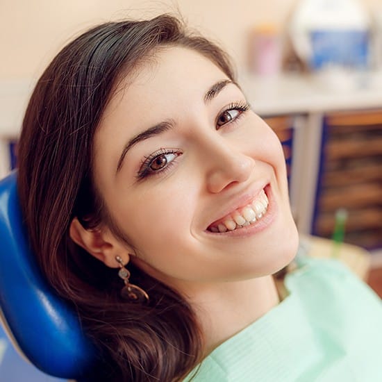 Woman smiling during dental checkup