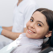 Teen girl smiling in treatment chair