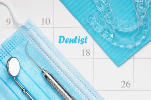 Aligners for Invisalign in Fairfax on top of calendar