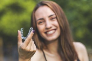 Smiling woman enjoying freedoms of Invisalign in Fairfax