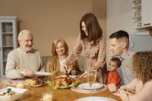 Family gathered at dinner table for the holidays