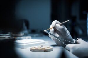 Technician creating dental crowns.